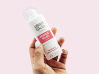 hand holding redness relief product